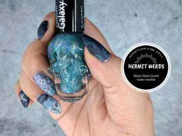 Black Heart-ed Floral - Hermit Werds - Nail art featuring Dark Heart brand nail polish (Hot Topic) in a water marble with floral stamping on top