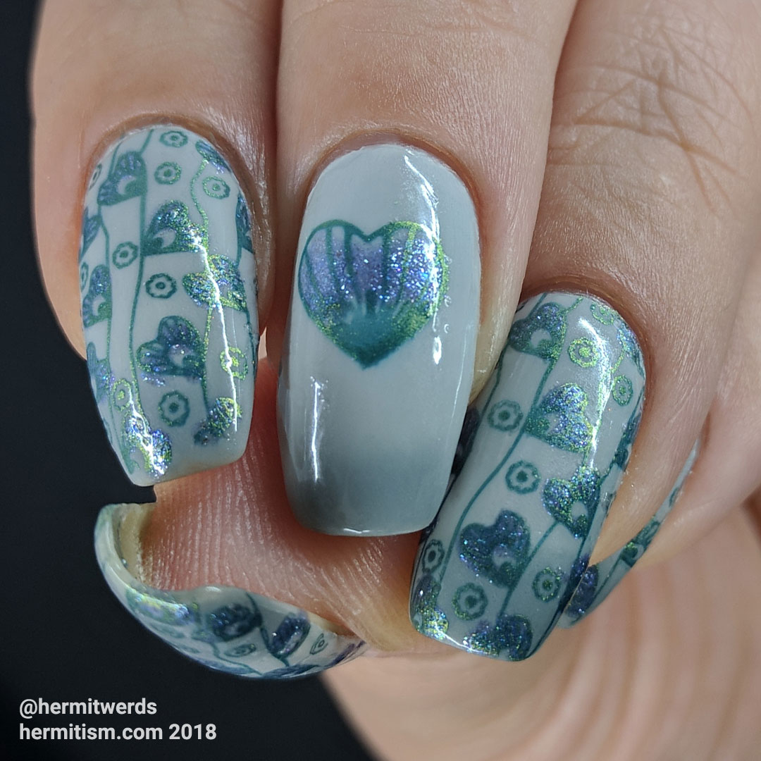 Patterns of the Heart - Hermit Werds - blue and green stamping on a grey thermal background