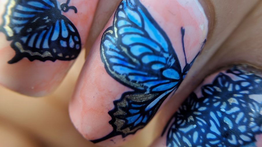 Garden Variety Butterflies - Hermit Werds - blue and orange watercolor-like nail art featuring butterflies that are half flower