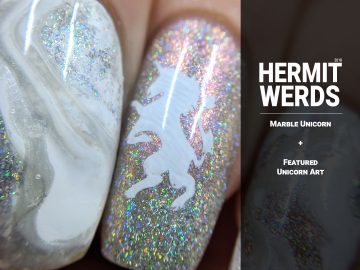 Marble Unicorn - Hermit Werds - white marble nails with swirls of shimmery holo and pearl with a unicorn rampant accent nail
