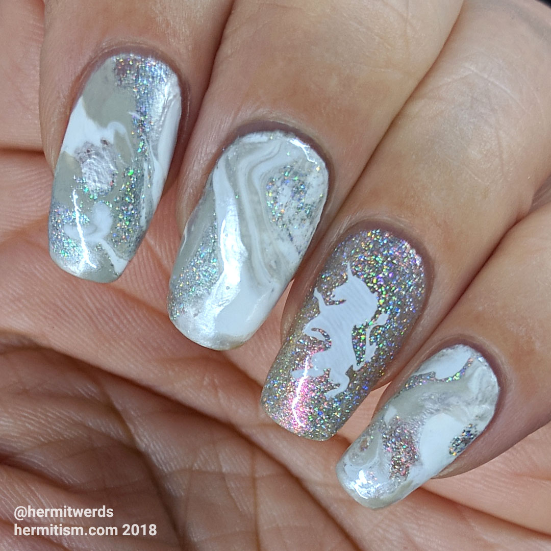 Marble Unicorn - Hermit Werds - white marble nails with swirls of shimmery holo and pearl with a unicorn rampant accent nail