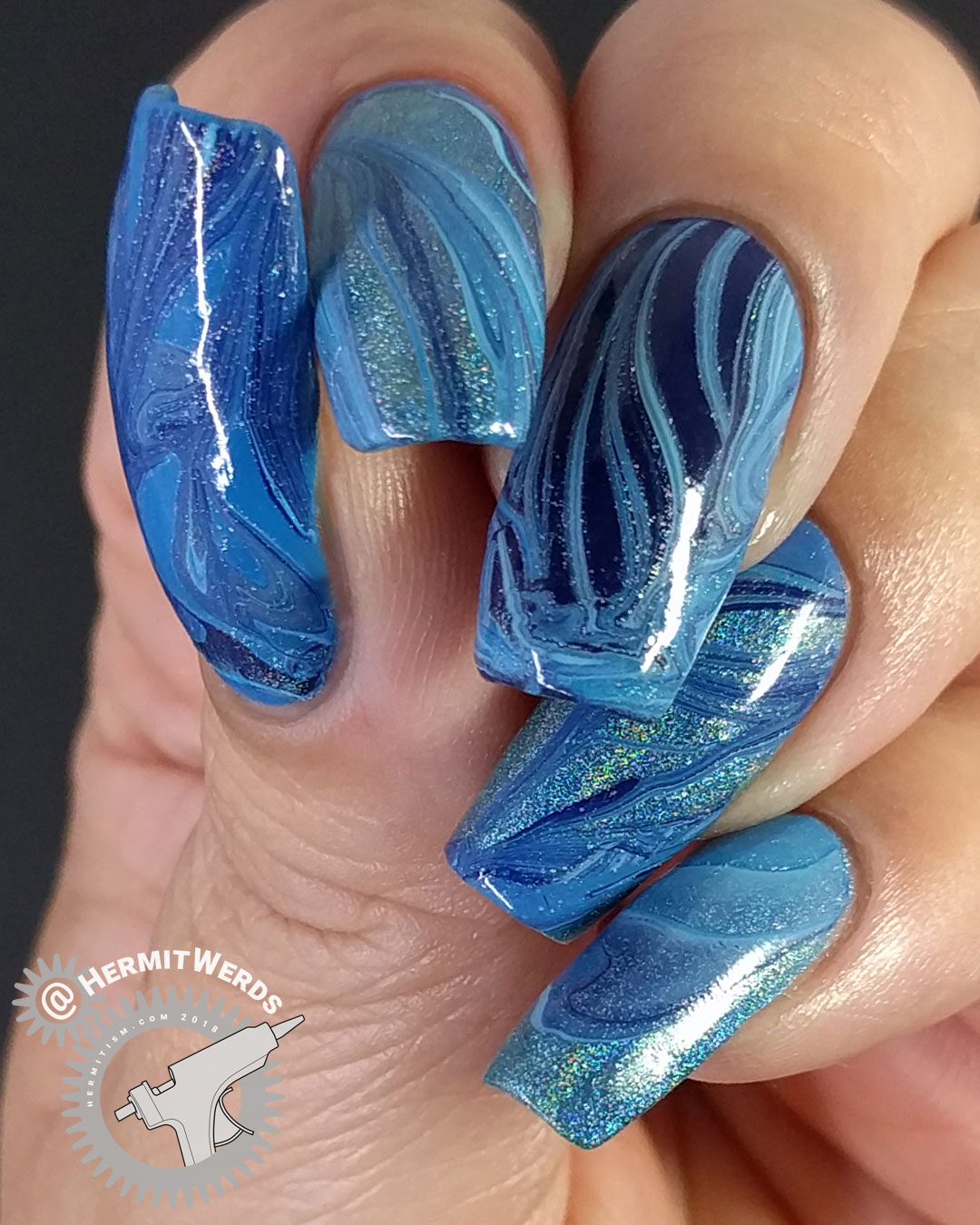 Blue Water Marble - Hermit Werds - blue water marble with four nail polishes