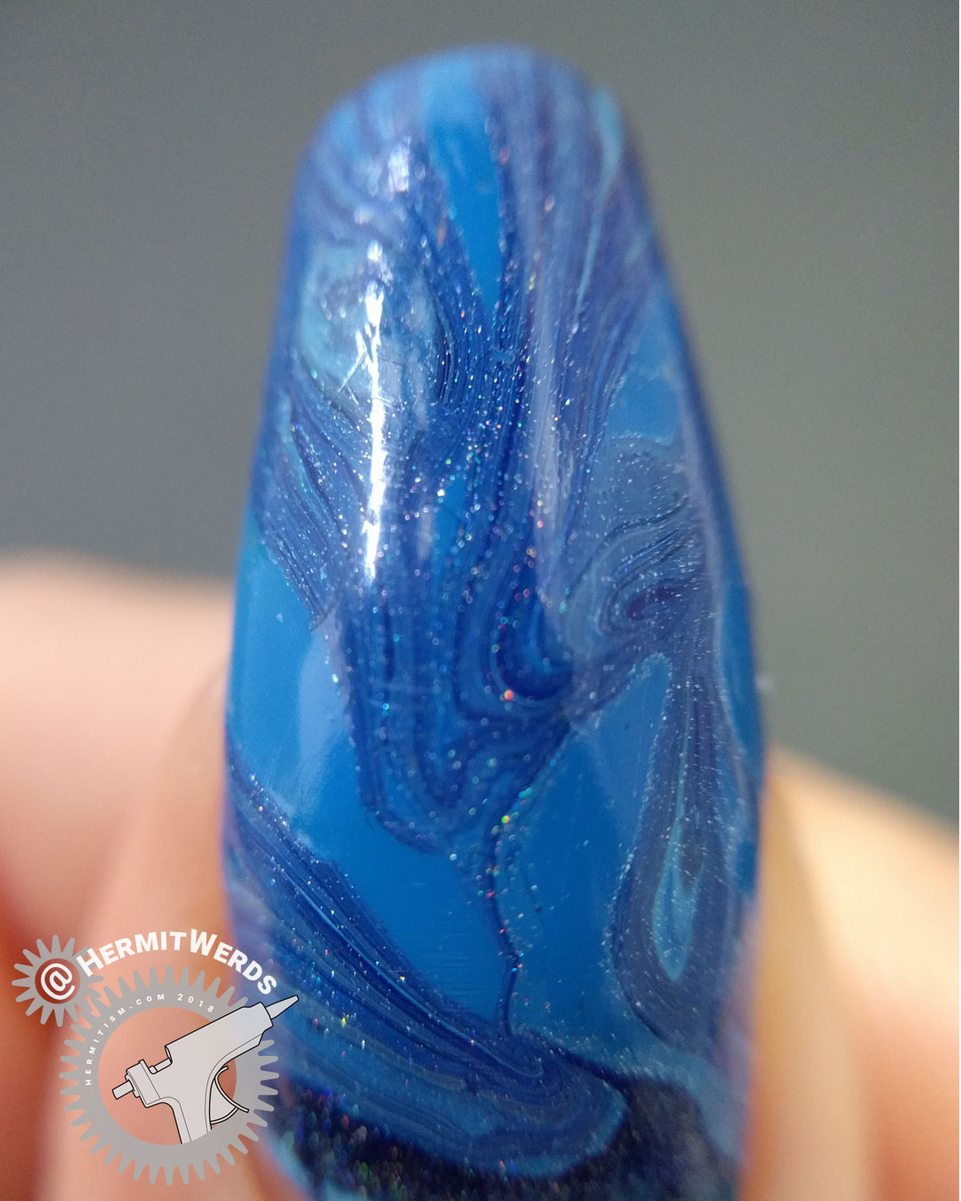 Blue Water Marble (macro) - Hermit Werds - blue water marble with four nail polishes