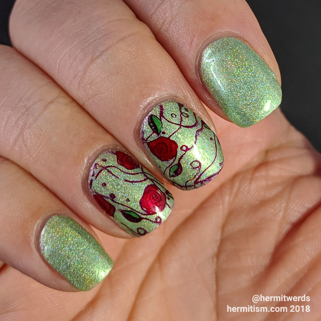 Fields of Roses - Hermit Werds - nail art of red rose vines against a green holographic background