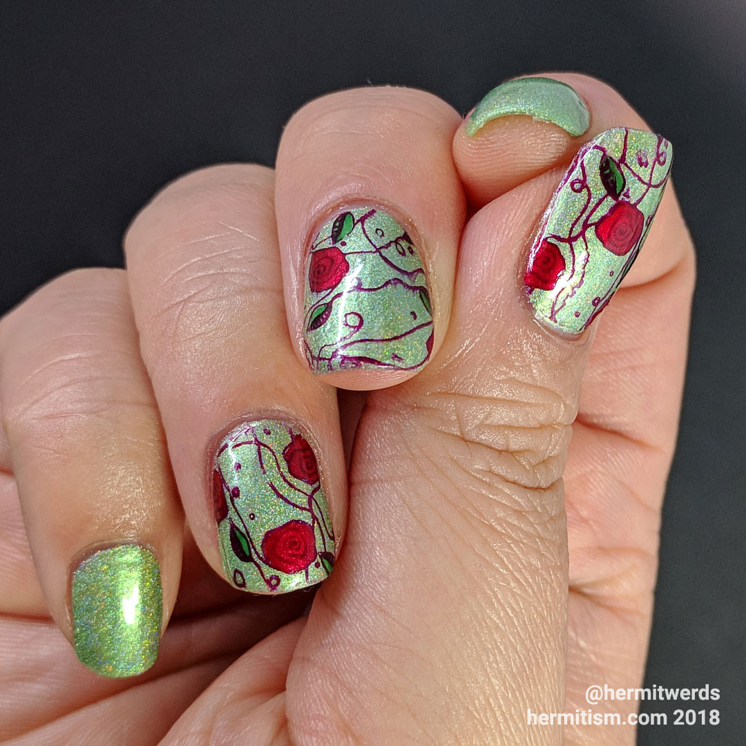 Fields of Roses - Hermit Werds - nail art of red rose vines against a green holographic background