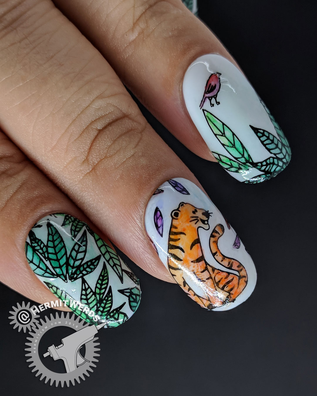 Tiger Munchies - Hermit Werds - nail art of watercolor tiger gazing hungrily at a little bird in the jungle