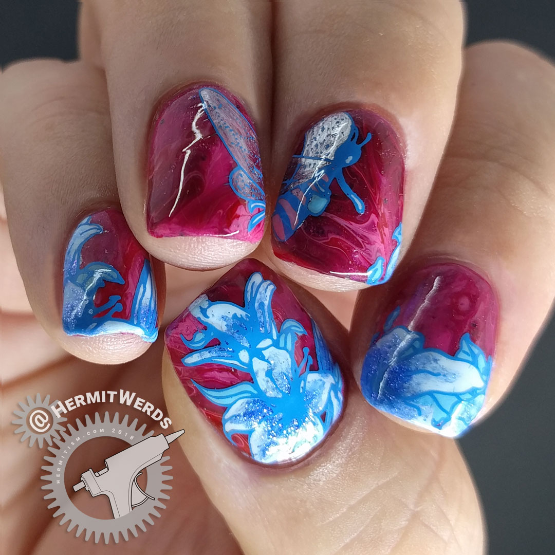 Lady of the Bees 2.0 - Hermit Werds - blue bee fairy stamping decal and lilies on a red to pink fluid art base.