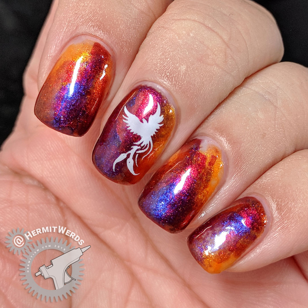 Dance of the Firebird - Hermit Werds - flame-colored duochrome nail art design with a firebird and feathers stamped on top