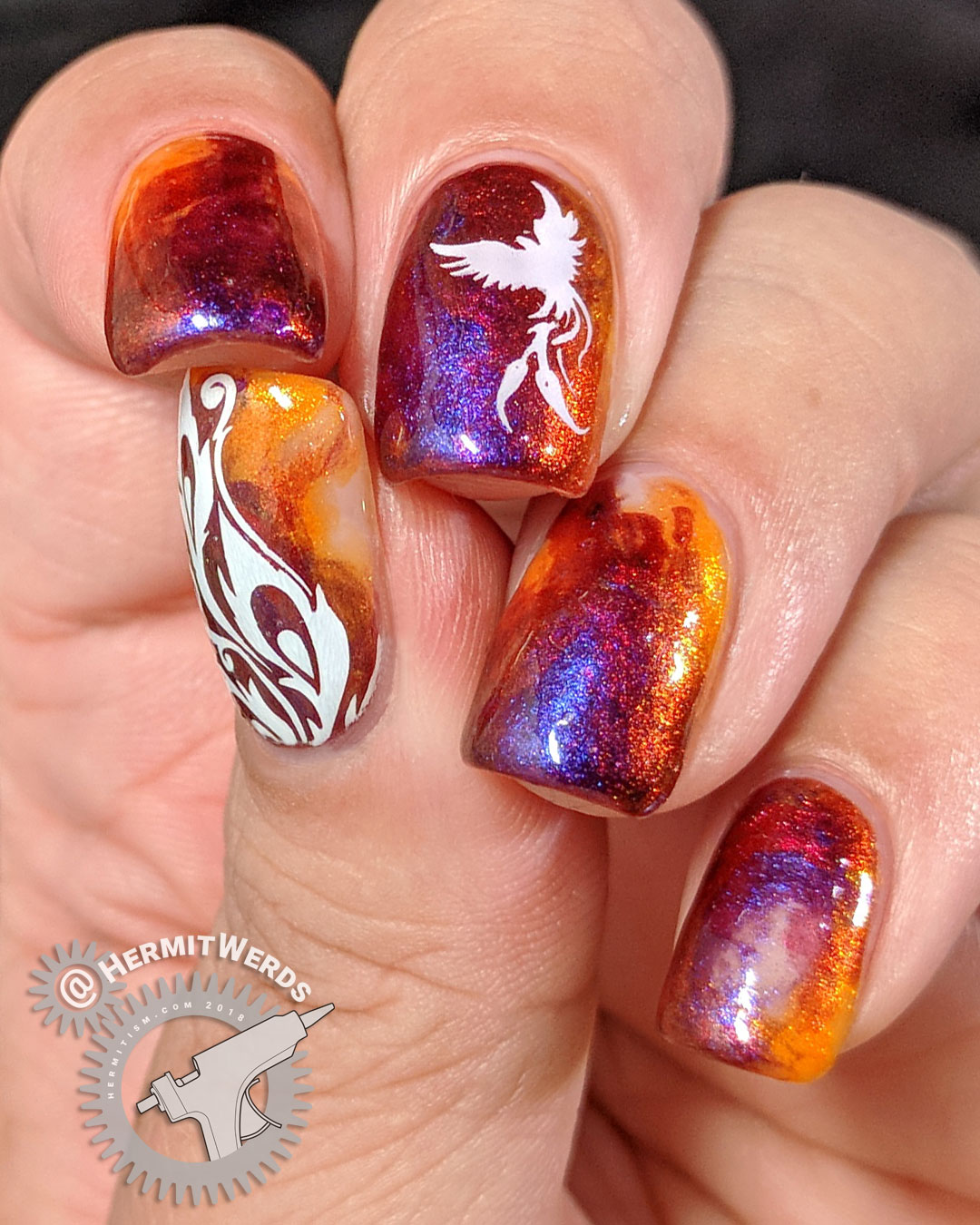 Dance of the Firebird - Hermit Werds - flame-colored duochrome nail art design with a firebird and feathers stamped on top
