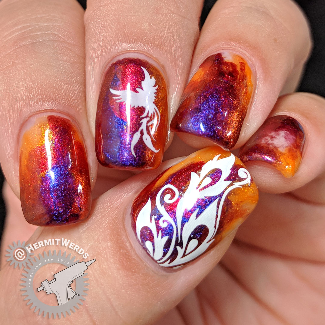 Dance of the Firebird - Hermit Werds - flame-colored duochrome nail art design with a firebird and feathers stamped on top