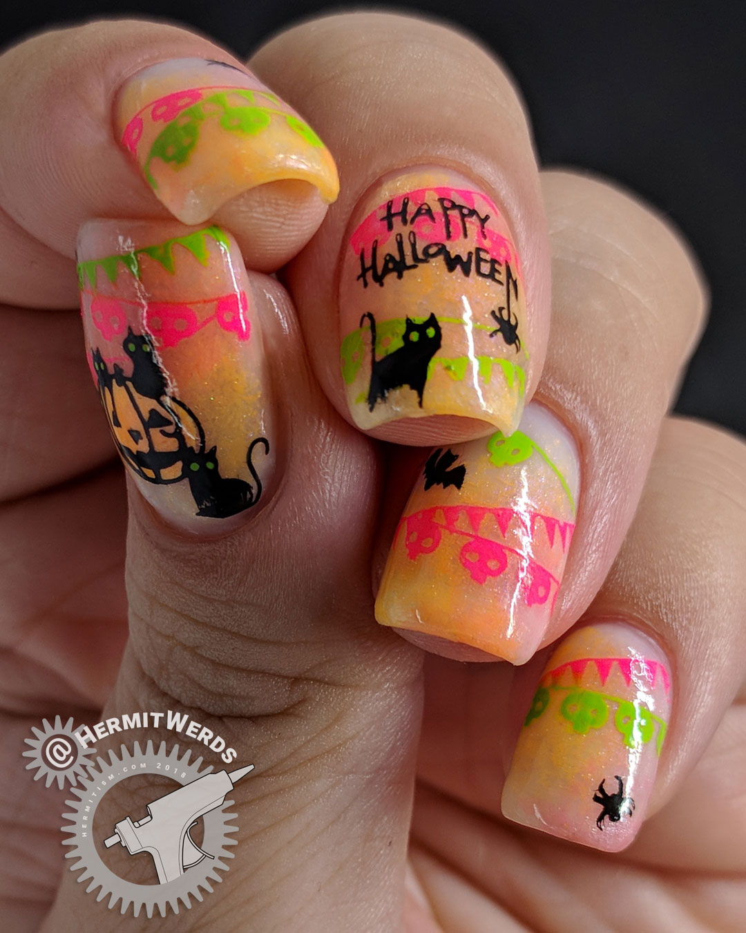 Halloween Cat Posse - Hermit Werds - neon pink and green banners behind spiders, bats, and a posse of black cats with a pumpkin