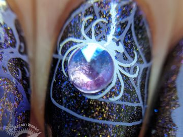 Thankfully Halloween - Hermit Werds - purple magnetic polish with spooky stamping (spider, ghouls, bats, haunted house) on top