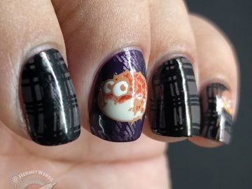 Pass the Puffer Fish - Hermit Werds - purple and grey plaid nail art with puffer fish decals on top