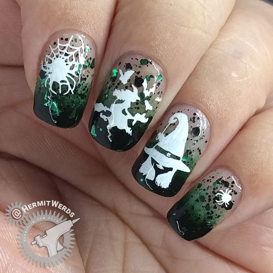 Witch of Spiders - Hermit Werds- dark green baby boomer french tips with black and green glitter and white witch and spider stamping on top