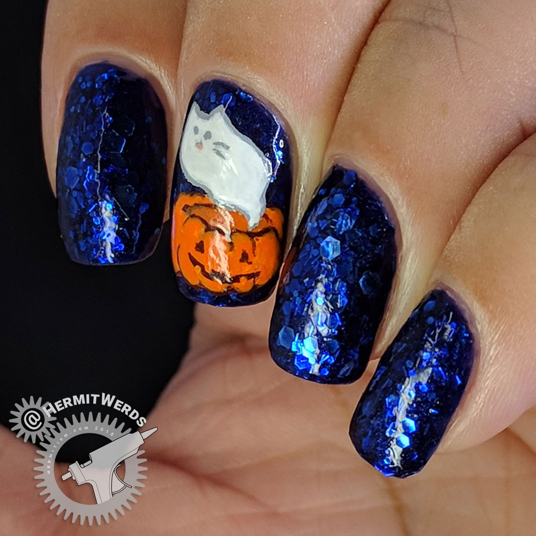 Spooky Pusheen - Hermit Werds - a Pusheen ghost emerging from a jack-o-lantern freehand painted on a royal blue glitter-y jelly base