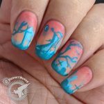 The Graveminder - Hermit Werds - salmon pink and teal nail art of a graveyard with a reaper attendant and zombies lurching in the background