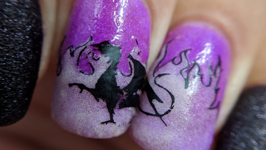 Wrath of the Dragon - Hermit Werds - purple nail art with the Maleficent dragon from Sleeping Beauty surrounded by blue glow in the dark flames.