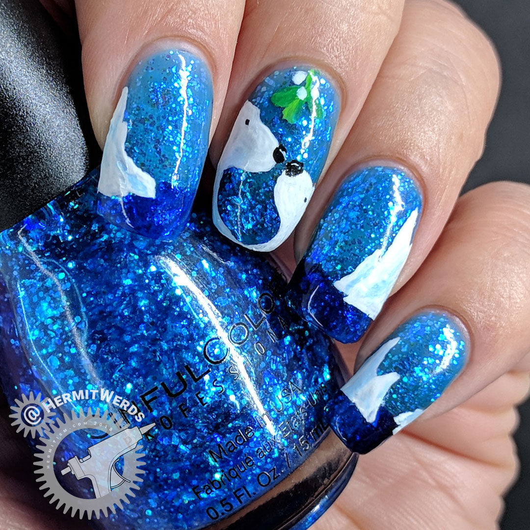 Sinful Colors' "Bangin' Blue" - Hermit Werds - freehand nail art of two polar bears about to kiss beneath the mistletoe on a blue jelly polish full of iridescent glitter with icebergs decorating the other nails