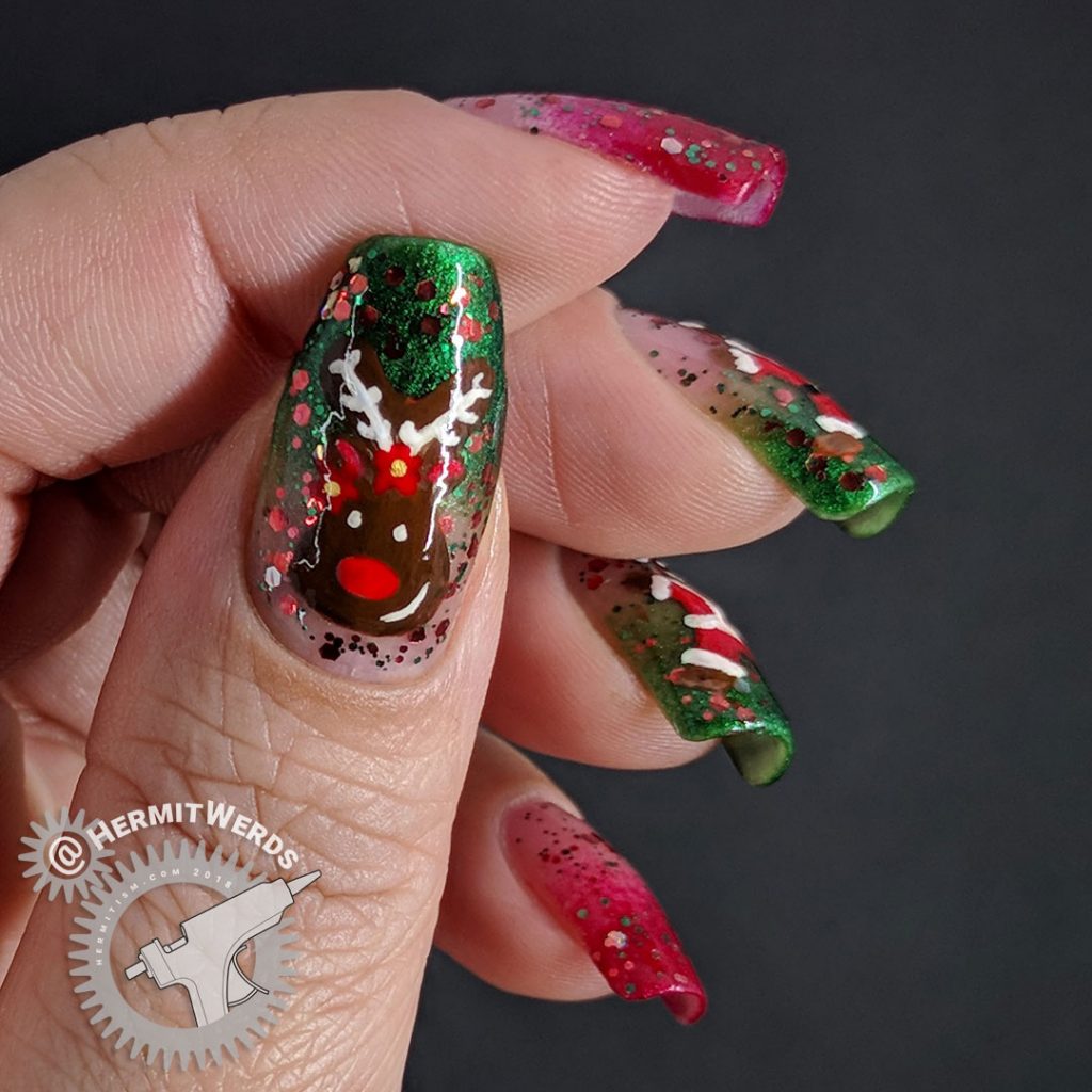 Santa Cookie - Hermit Werds - glittery red and green baby boomer french tip nails decorated with gingerbread Santa, Mrs. Clause, and Rudolph cookies