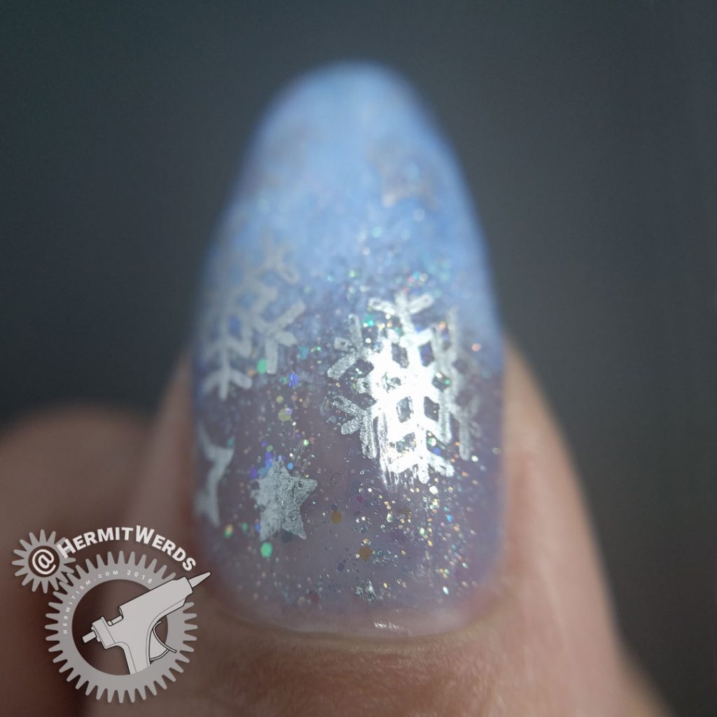 Snowy Baby Boomer French Tip - Hermit Werds - light blue jelly filled with iridescent glitter fading into a blue-tinted gradient with silver snowflakes on top