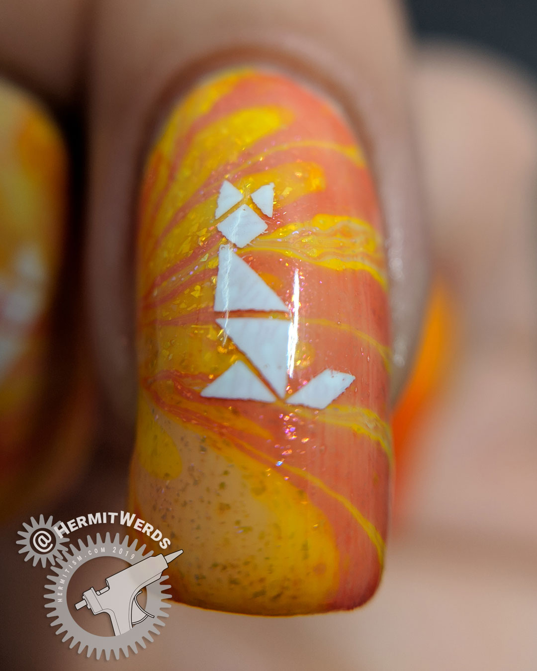 Kitty Tangrams - Hermit Werds - sparkly orange water marble nail art with two white cat tangram puzzles stamped on top