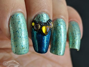 Bejeweled Mint - Hermit Werds - glittery mint mani with bejeweled accent nail covered in yellow rhinestones and black caviar beads