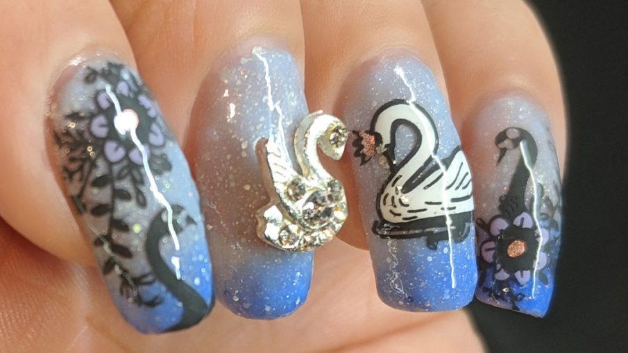 Swan Lake - Hermit Werds - a swan princess and rhinestone nail charm swan on a thermal/solar polish with attendant swans