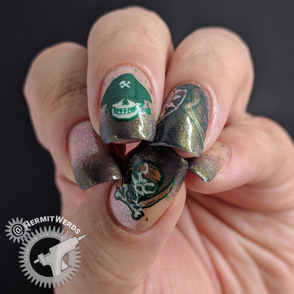 Brown and green skeletal pirate nail art with map and compass.