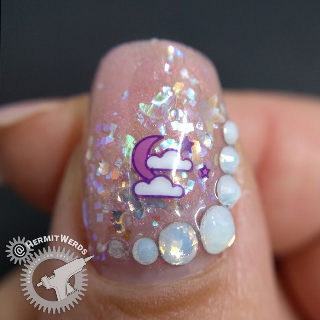 Delicate pink nail art with cute Halloween icons and opal glitters and rhinestones.