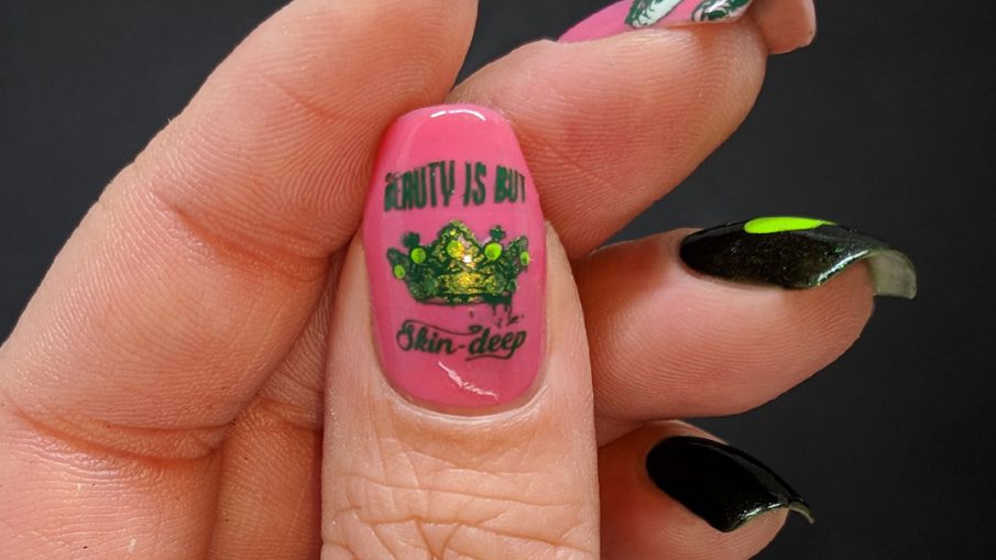 Green and pink nail art featuring the Evil Queen and her apple from Snow White.