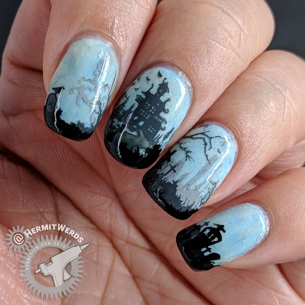 Glow in the dark haunted graveyard nail art with overlooking castle.