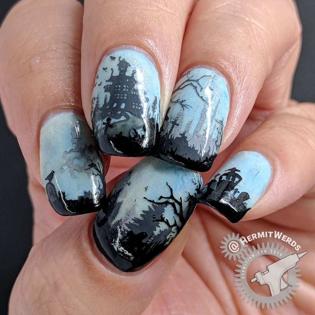 Glow in the dark haunted graveyard nail art with overlooking castle.