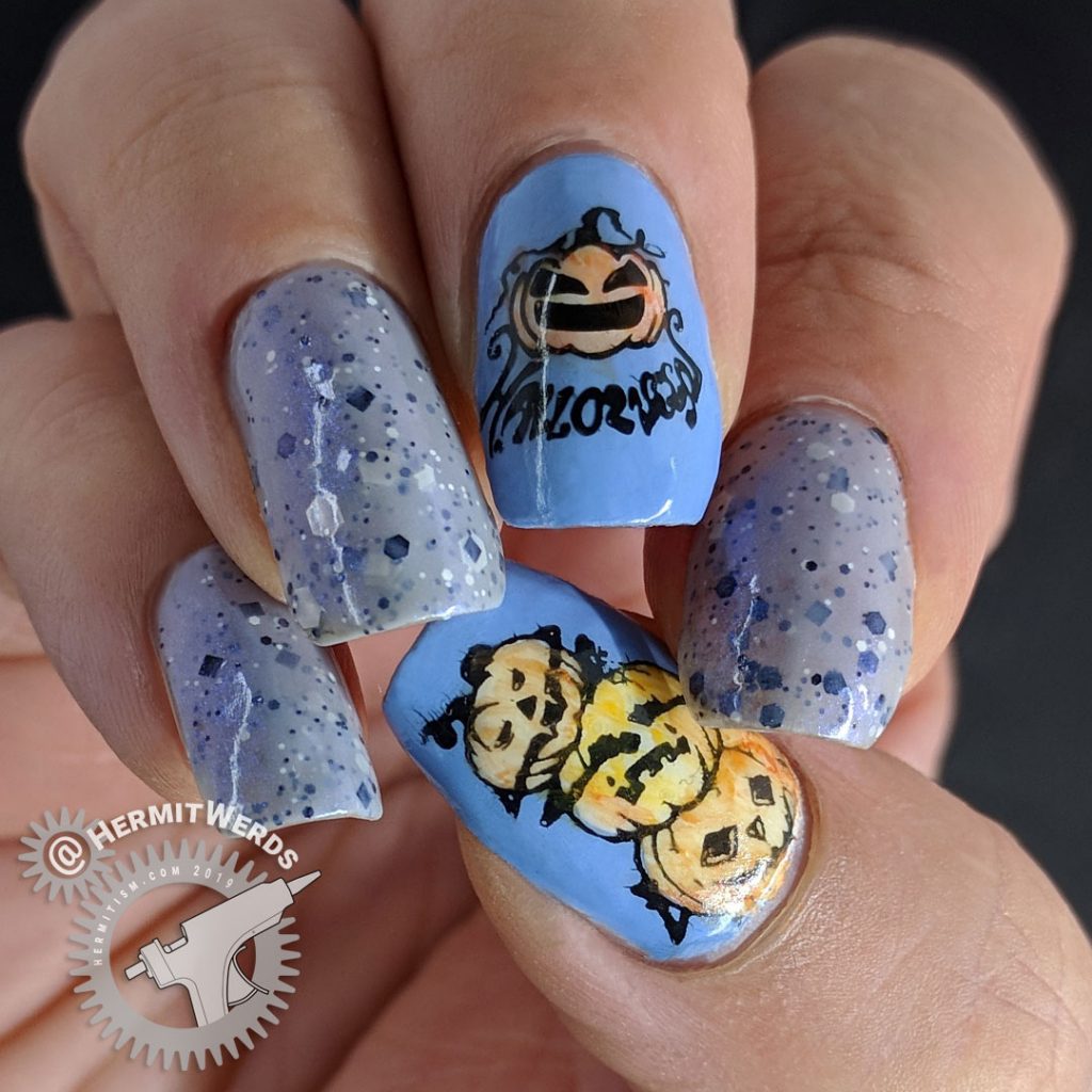 Grey crelly polish with blue jack-o-lantern nails colored in with watercolor paint.