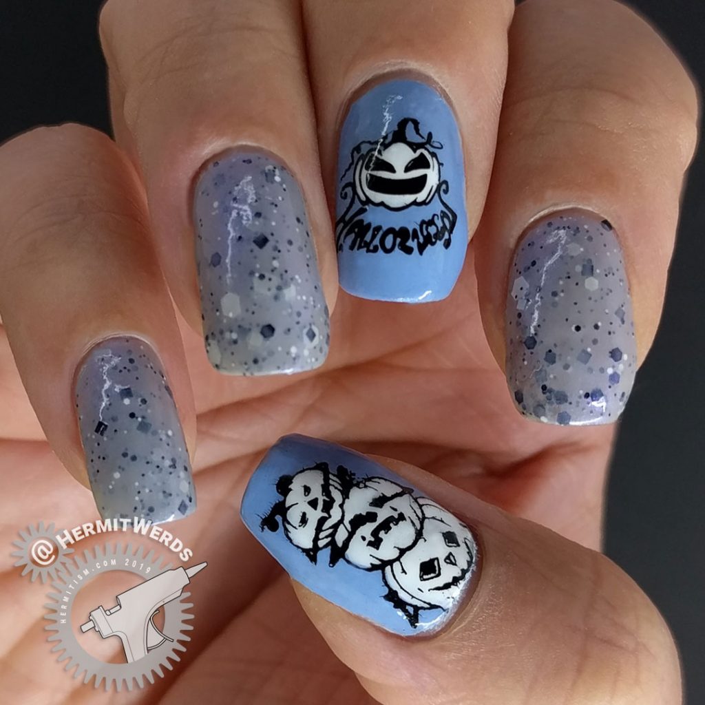 Grey crelly polish with blue jack-o-lantern nails colored in with watercolor paint.