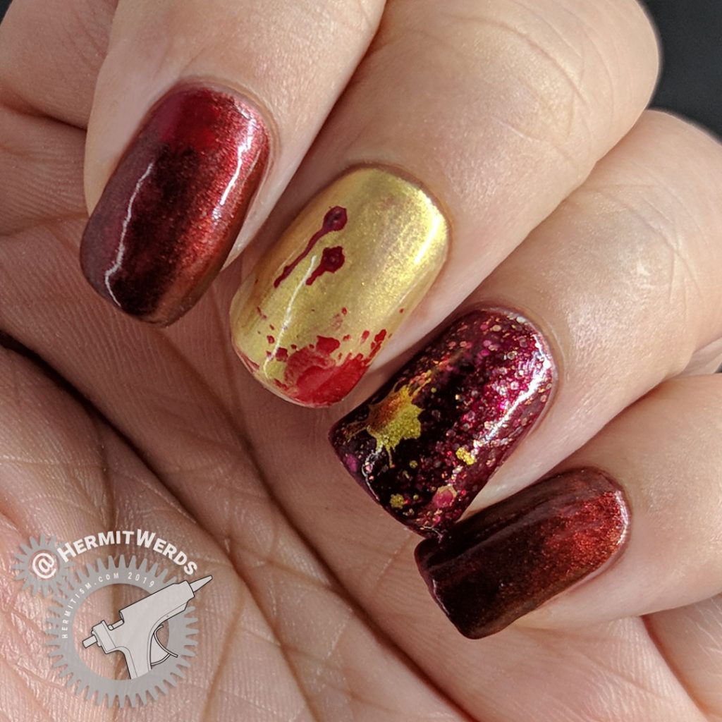 Red and gold metallic bloody vampire nail art for Halloween.