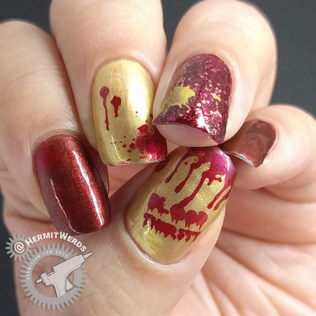Red and gold metallic bloody vampire nail art for Halloween.