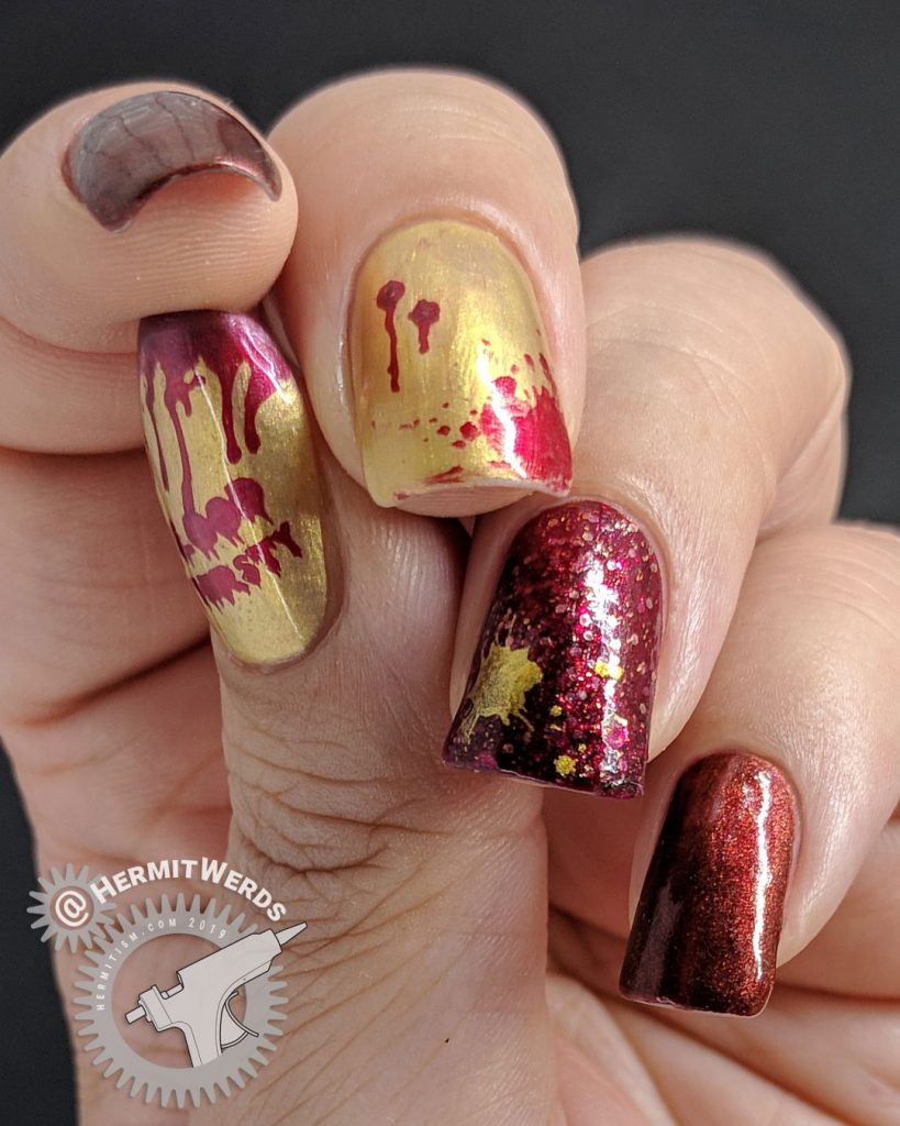 Red and gold metallic bloody vampire nail art for Halloween.