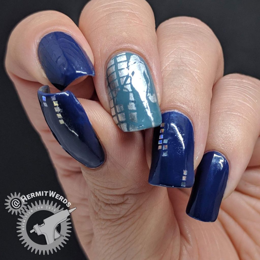 Blue nail art with holographic silver squares and a glamourous lady shopper
