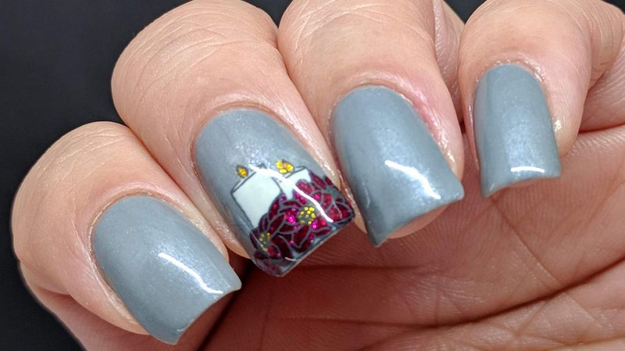 Frost Grey nails with a beautiful poinsettia and candles reverse nail stamp.