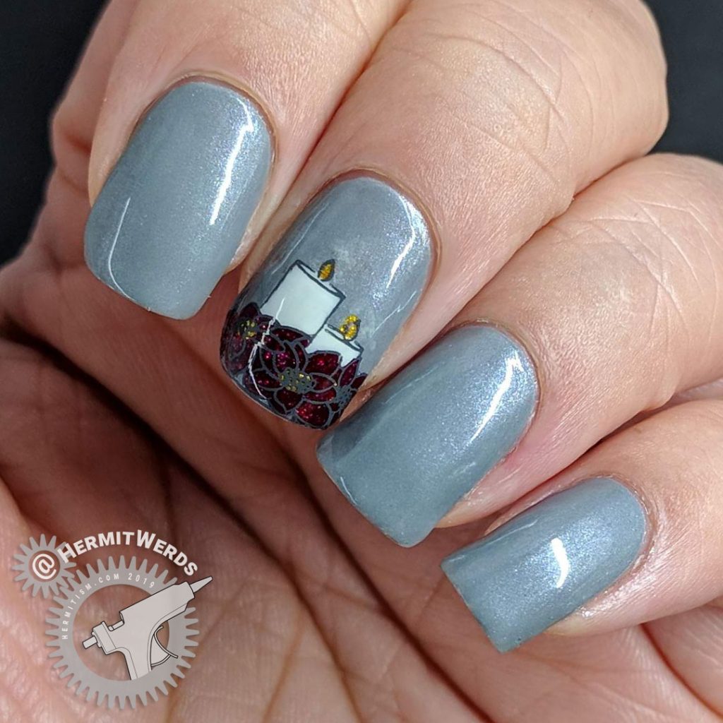 Frost Grey nails with a beautiful poinsettia and candles reverse nail stamp.