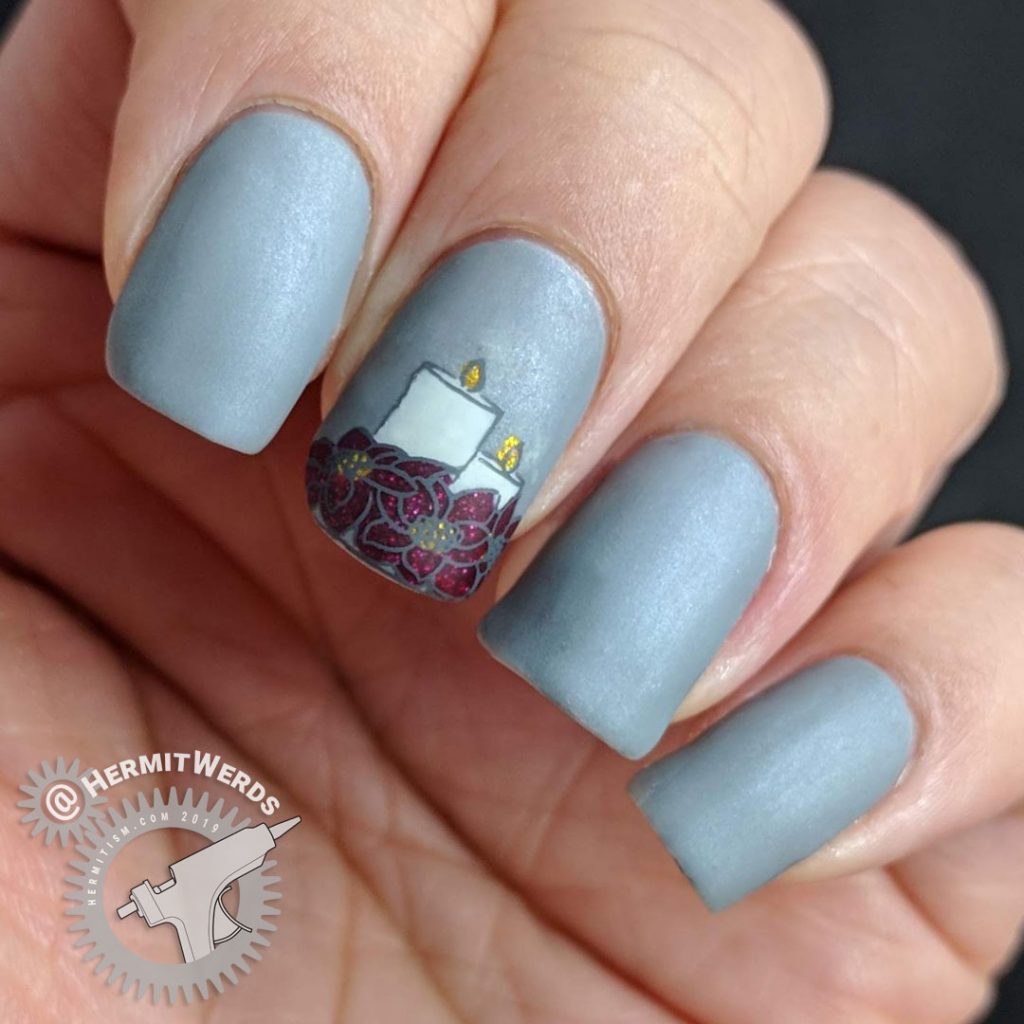 Frost Grey nails with a beautiful poinsettia and candles reverse nail stamp.