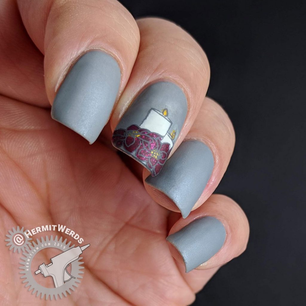 Frost Grey nails with a beautiful poinsettia and candles reverse nail stamp.