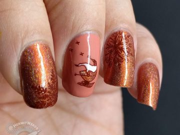 Adorable skiing Santa nail art with an orange holographic color scheme and snow flake stamps.