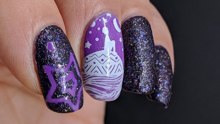 Dreamy purple glow in the dark nail art with a child stargazing on the back of a whale.