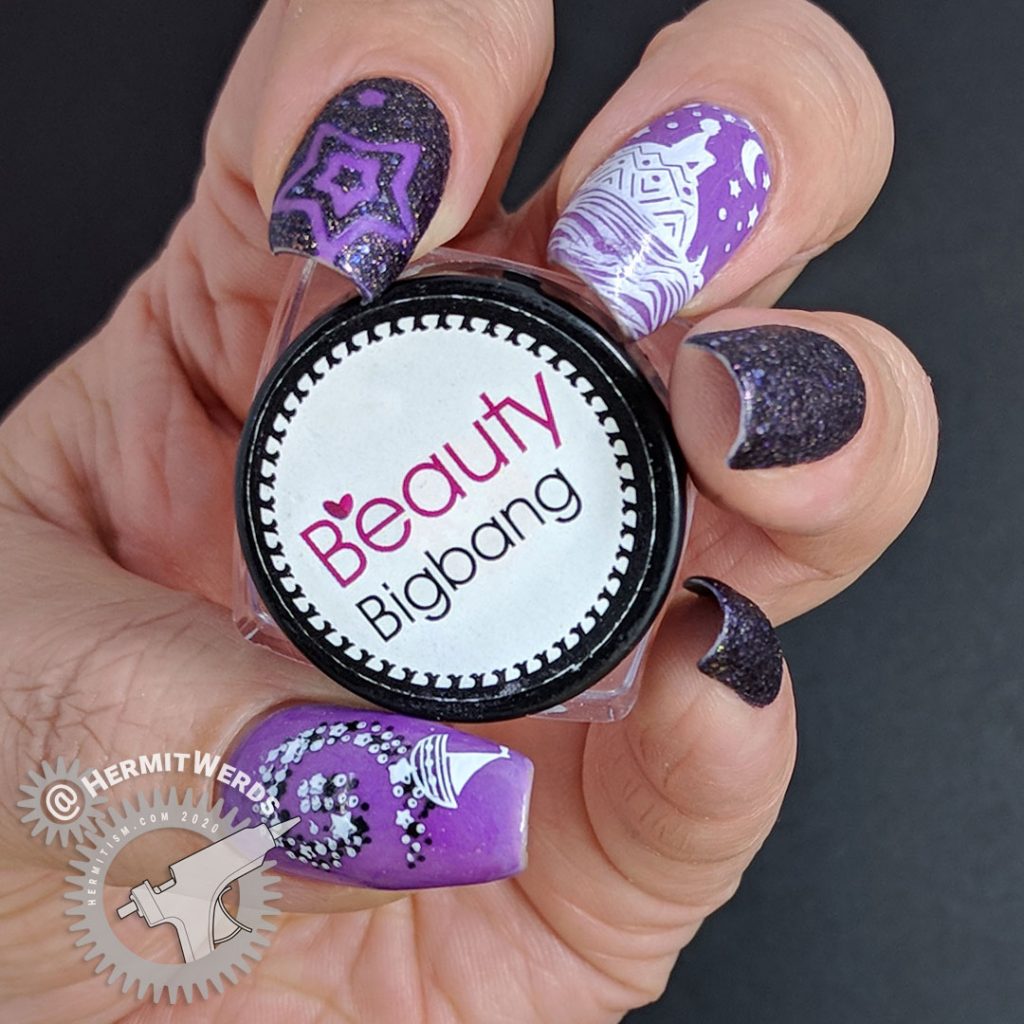 Dreamy purple glow in the dark nail art with a child stargazing on the back of a whale.