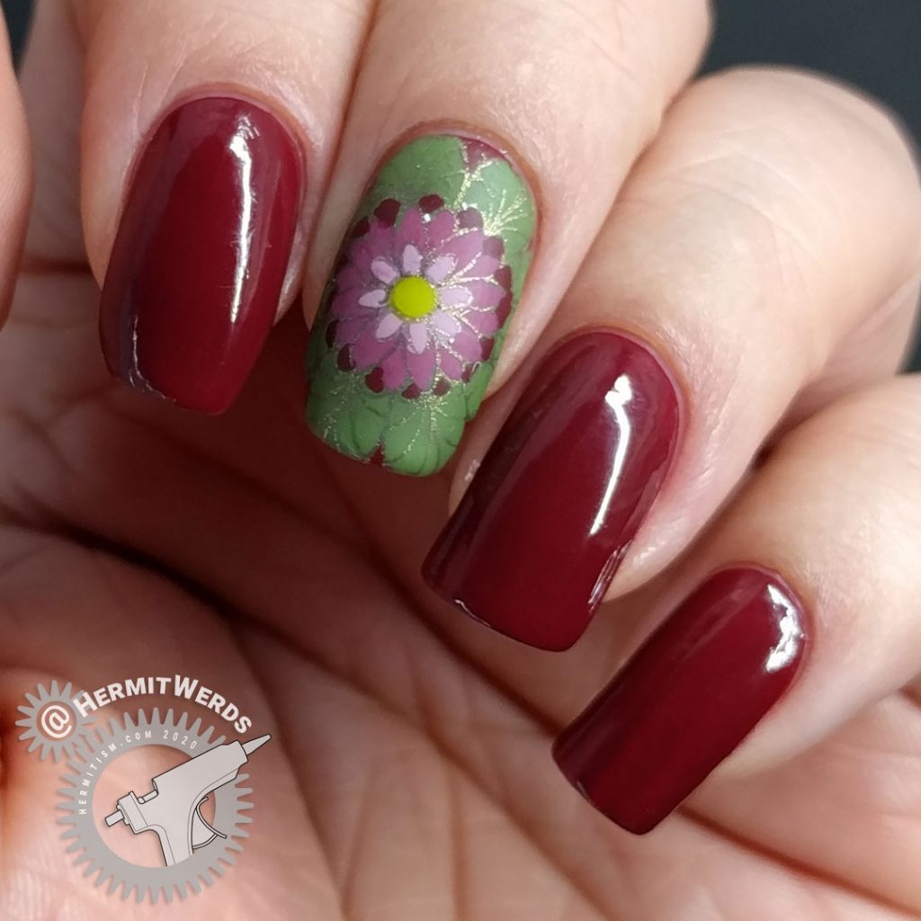 A deep red (merlot) nail art with a few brightly colored mandala decals.