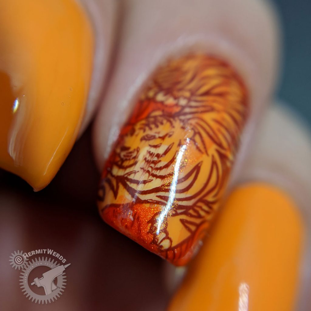 Orange nail art with a fierce tiger stamping decal inspired by Pantone's Orange Tiger color.