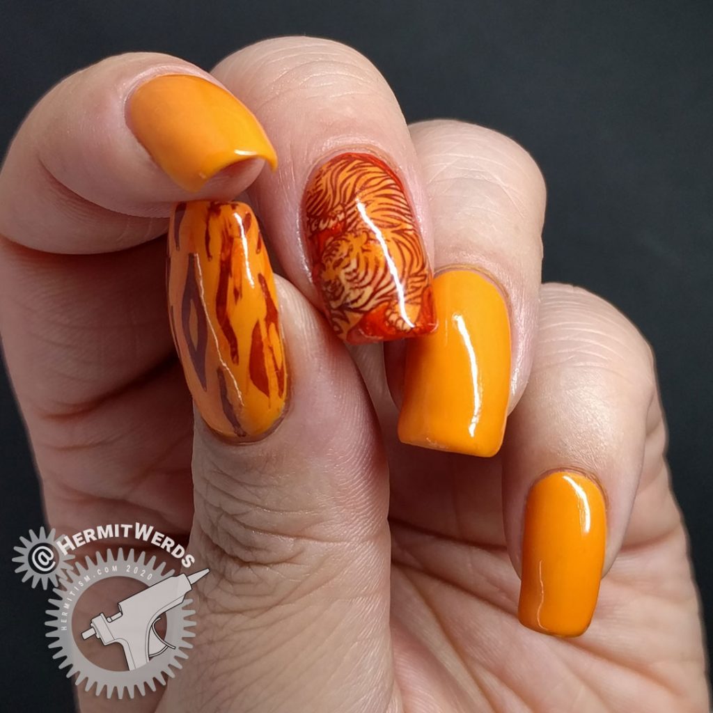 Orange nail art with a fierce tiger stamping decal inspired by Pantone's Orange Tiger color.