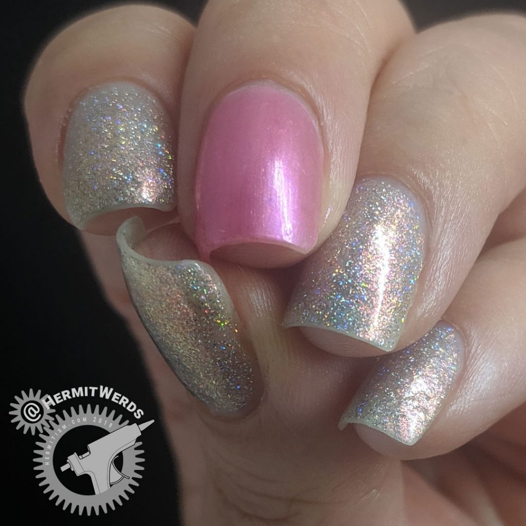 Pink holographic mani with a single pearly pink accent nail.