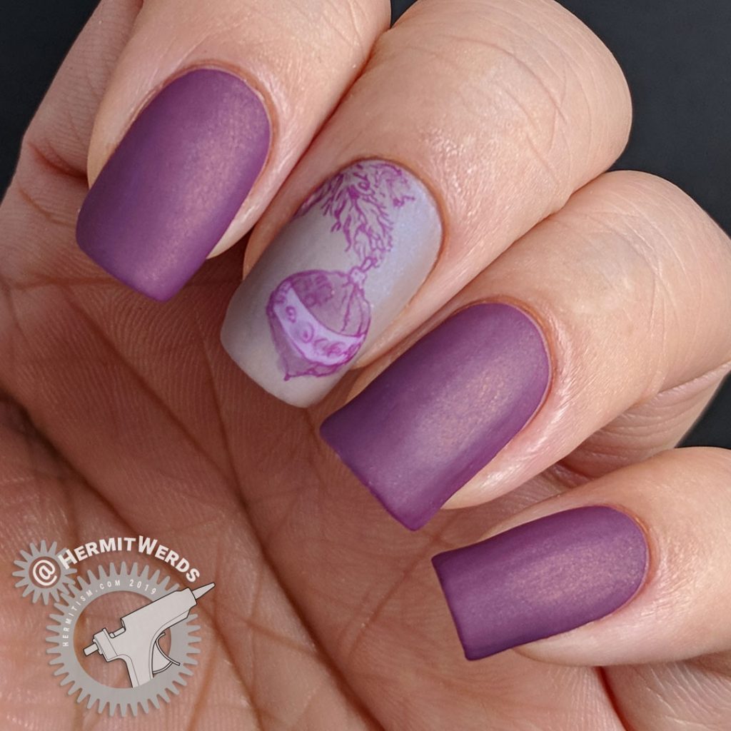 Matte purple nail art with an ornament hanging from a Christmas tree stamping decal.